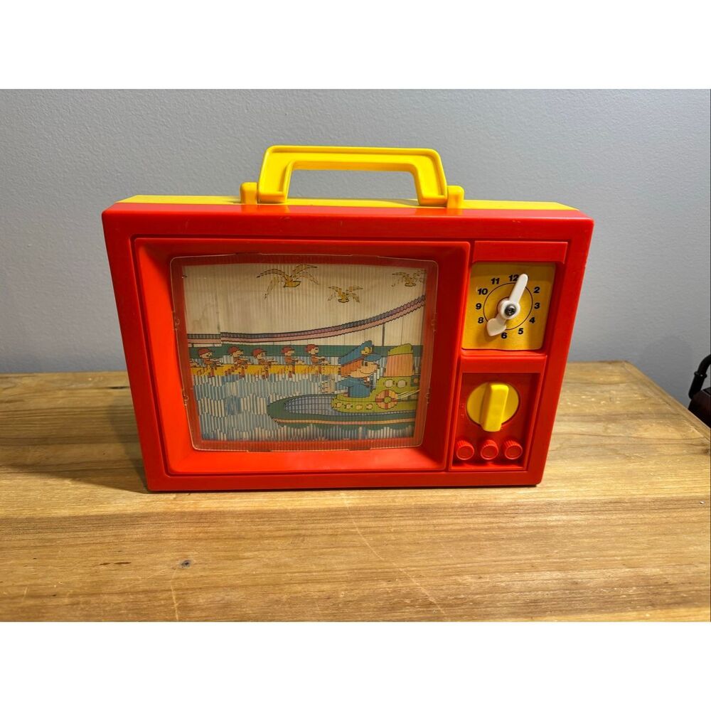 Vintage 1979 Blue Box wind-up musical toy television with moving screen